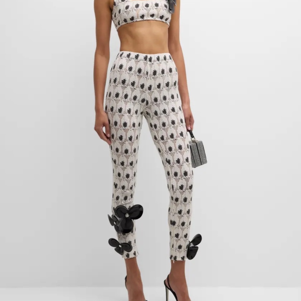 AREA eye crochet knit pants featuring crystal flower appliqué size M